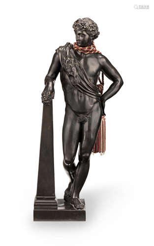 Late 19th century  A large bronze Classical man leaning against an obelisk, possibly Antinous