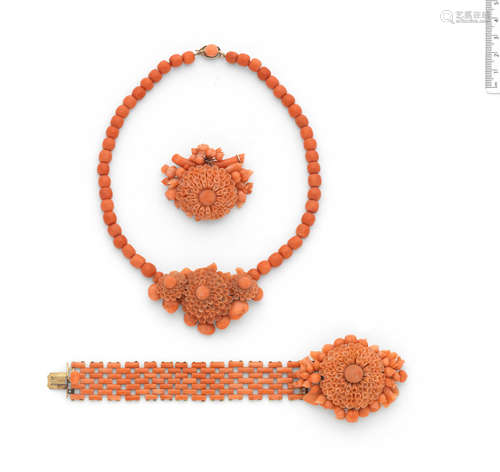 (3) A mid 19th century carved coral necklace, bracelet and brooch suite