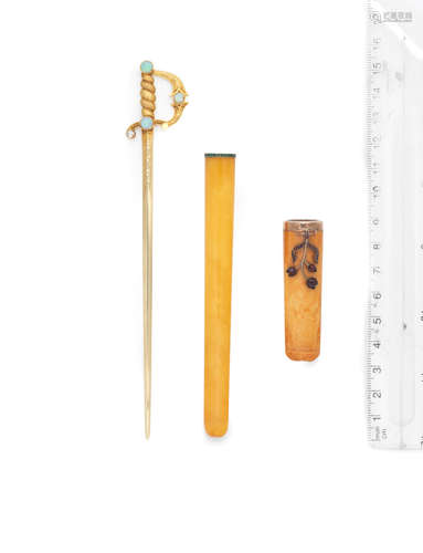 (3) An amber cigarette holder, French, circa 1925, an amber cheroot holder, circa 1900, and a gem-set letter opener, circa 1900