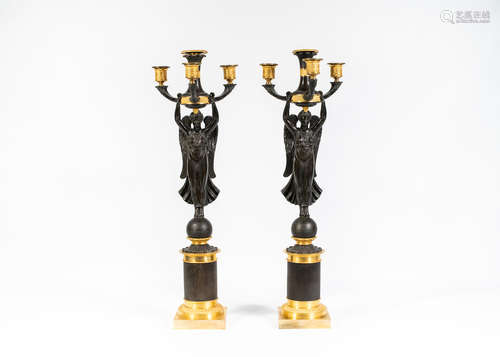 In the manner of Pierre-Philippe Thomire A pair of 19th century bronze and ormolu three-light candelabra