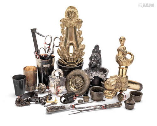 A small collection of steel and bronze objects