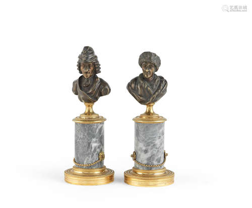 A pair of French 19th century bronze busts of Voltaire and Rousseau