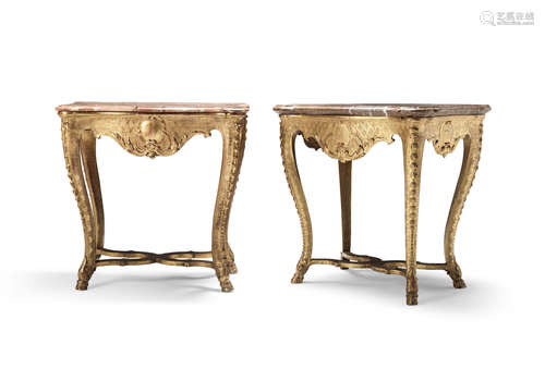 A pair of German 18th century carved giltwood and gesso console tables