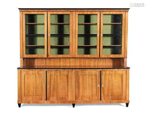 A large Biedermeier cherrywood and ebonised library bookcase