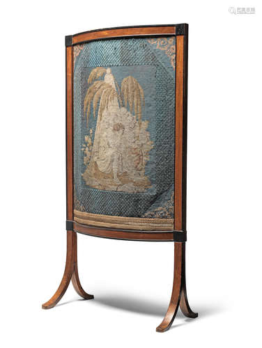 An early 19th century mahogany and ebonised fire screen