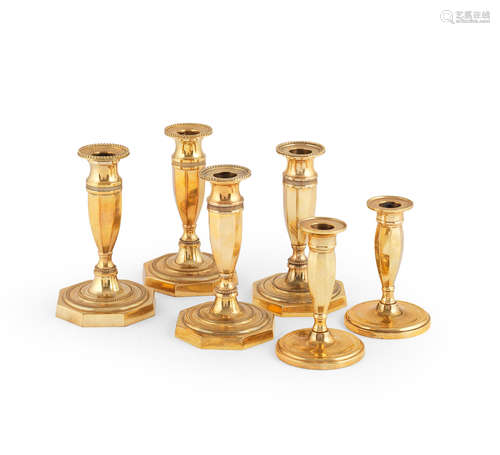 Three pairs of 19th century gilt-bronze candlesticks