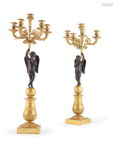 Probably Restoration A pair of French first half 19th century gilt and patinated bronze  five branch candelabra