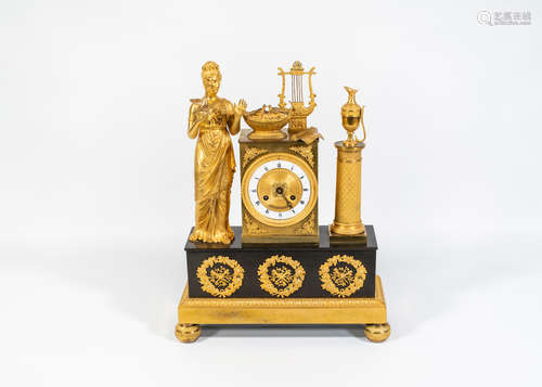 An Empire gilt and patinated bronze clock depicting an Allegorical scene