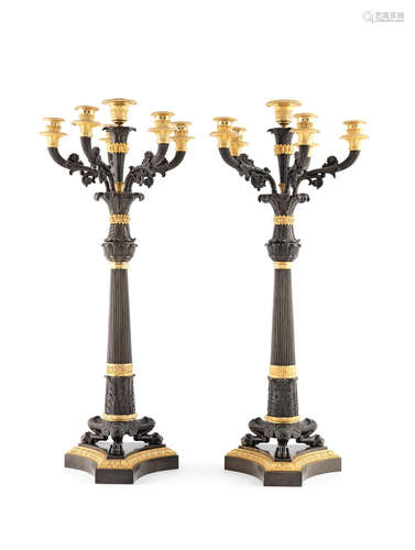 A large pair of French 19th century patinated and gilt bronze candelabra