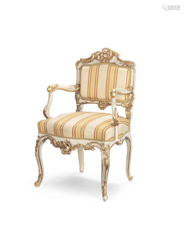 Late 19th / early 20th century, in the Rococo A North Italian carved painted and parcel gilt fauteuil