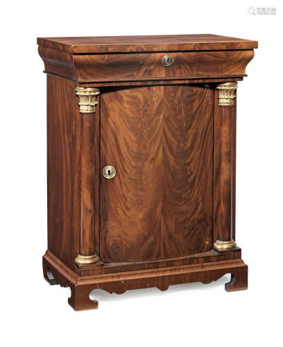 A Charles X mahogany and parcel-gilt cupboard