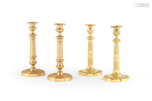 Two pairs of French 19th century gilt-bronze candlesticks