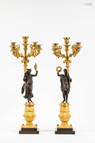 A pair of Restoration patinated and gilt-bronze candelabras