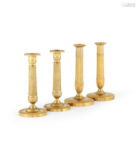 In the Empire style Two pairs of French 19th century gilt-bronze candlesticks