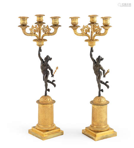 A pair of French 19th century patinated and gilt bronze candelabra