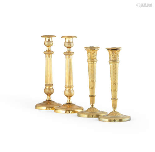 Two pairs of French 19th century gilt bronze candlesticks