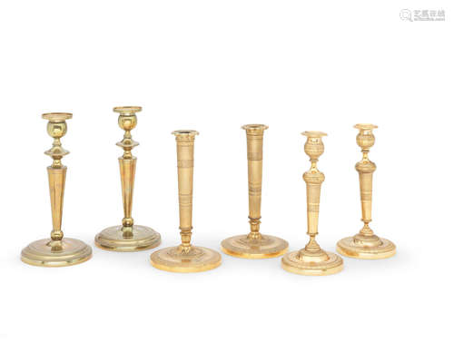 Three pairs of French 19th and early 20th century gilt-bronze and gilt-metals candlesticks