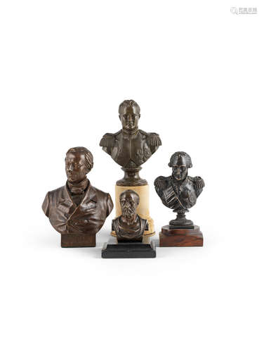 A group of four bronze busts