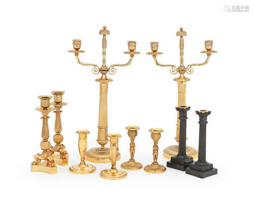 A pair of 19th century bronze Corinthian column candlesticks