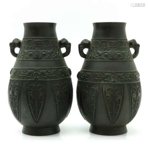 A Pair of Bronze Vases