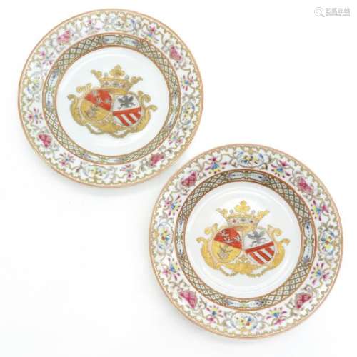 A Pair of Family Crest Decor Plates