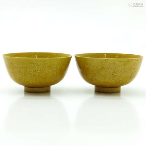 A Pair of 2 Yellow Glazed Bowls