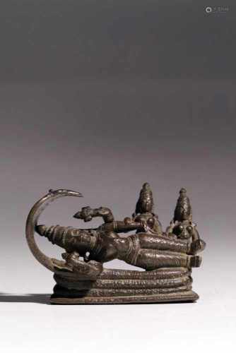 VishnuBronzeIndia18th ctL: 8 cmVishnu resting on his five-headed cobra Sheeshnag. The serpents heads