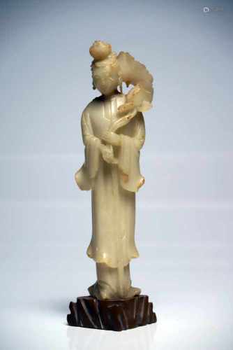 White GuanyinJadeChina19th ctH: 28 cmStanding Guanyin holding a lotus flower over his left