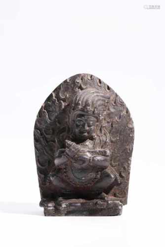 MahakalaStone,Tibet, 18th centuryH: 8,5 cmStone figure of God Mahakala standing on a victim framed