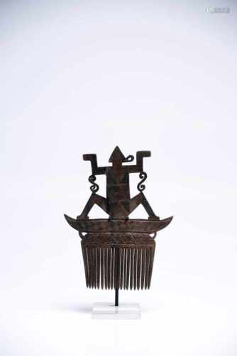 Hair CombHornIndonesia19th ctH: 13 cmDelicately engraved hair comb. A human-like figure is sitting