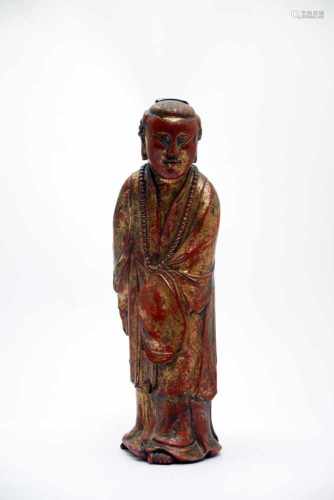 ScholarWood red paintedVietnam18th ctH: 32 cmThis red and gold lacquered statue shows a scholar in a