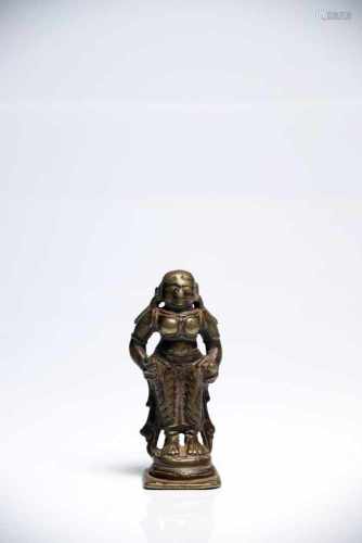 Female DeityBronzeIndia16th ctH: 8 cmA standing deity dressed in dhoti, holding two objects in