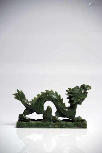DragonJadeChina20th ctL: 15 cmA Chinese dragon in motion with opened mouth, standing on a cloud, his