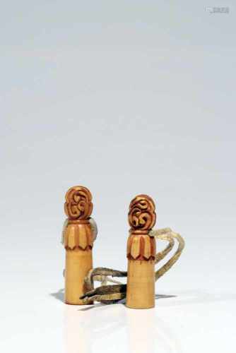 Pair of SealsBoneTibet18th ctH: 5 cmTwo seals made of bone, each of them has a string attached