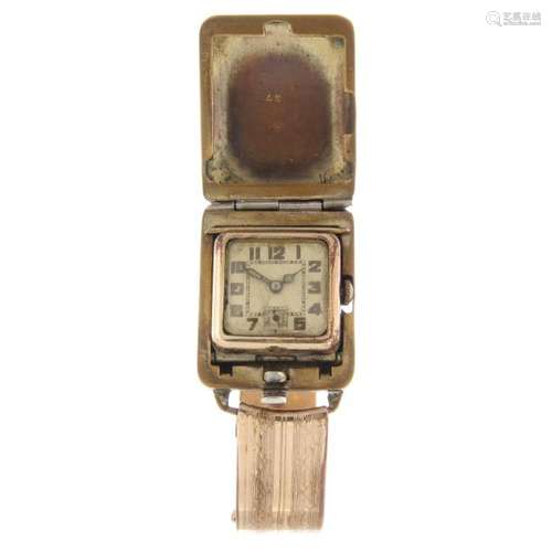 A 'flip open' bangle watch. Gold plated case. Unsigned