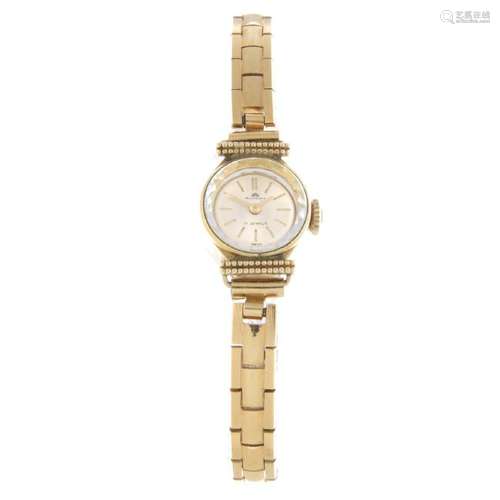 BUCHERER - a lady's bracelet watch. Gold plated case.