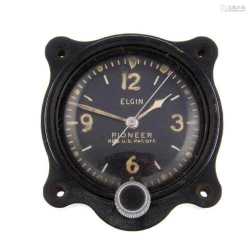 A Pioneer military travel clock by Elgin. Base metal