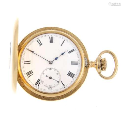 A half hunter pocket watch by Waltham. Yellow metal