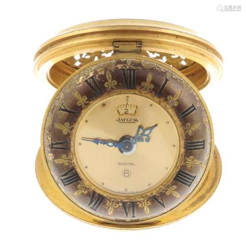 A desk alarm clock by Jaeger. Gold plated case.