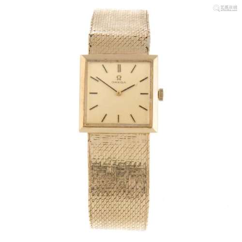 OMEGA - a gentleman's bracelet watch. 9ct yellow gold