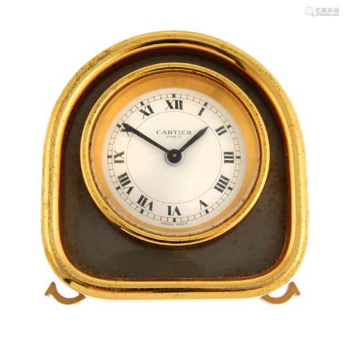 An alarm clock by Cartier. Gold plated case. Reference