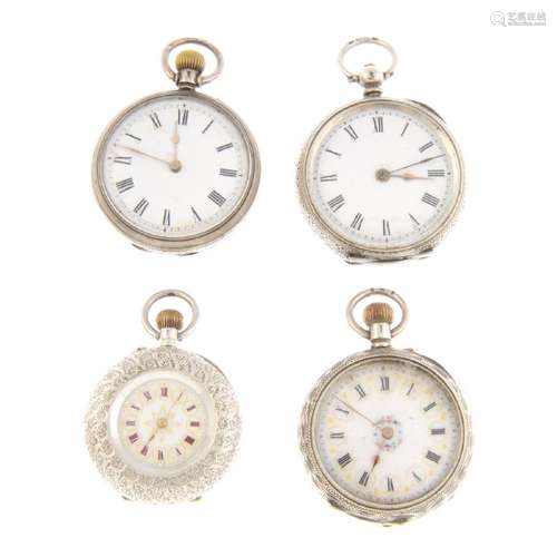 A group of four assorted white metal pocket watches.