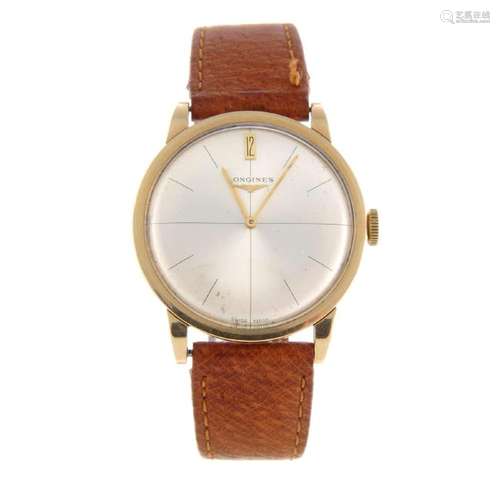 LONGINES - a gentleman's wrist watch. 9ct yellow gold