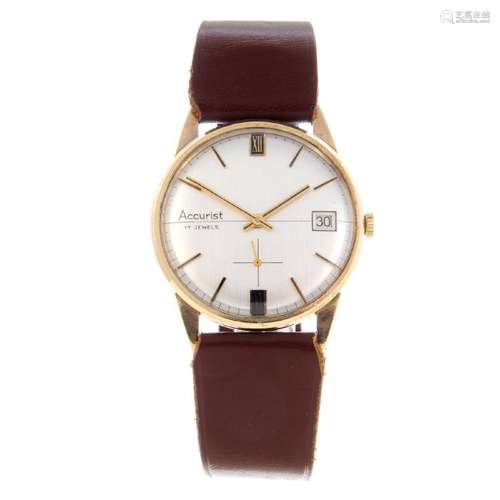 ACCURIST - a gentleman's wrist watch. 9ct yellow gold