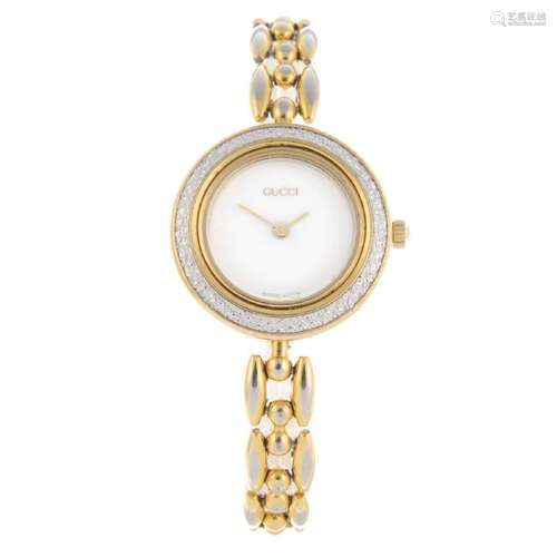 GUCCI - a lady's 11/12.2 bracelet watch. Gold plated