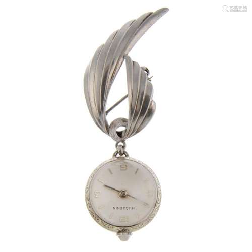 A pendant watch by Huguenin. White metal case with