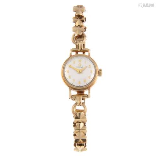 OMEGA - a lady's bracelet watch. 9ct yellow gold case,