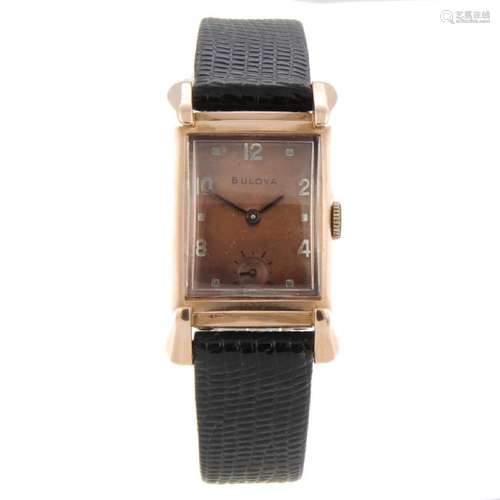 BULOVA - a wrist watch. Rose metal case, stamped 14K