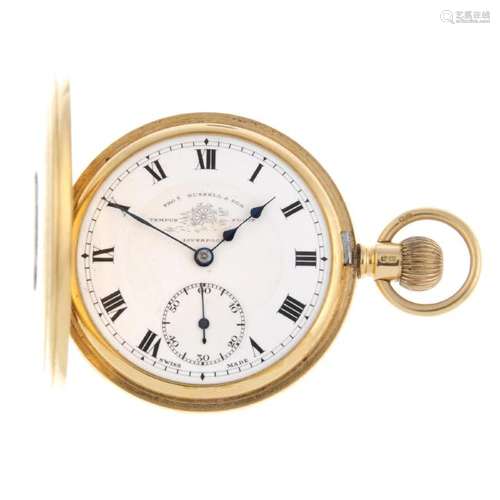 A half hunter pocket watch by T.Russell & Son. 18ct