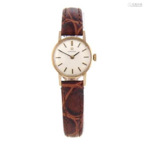 OMEGA - a lady's wrist watch. 9ct yellow gold case,